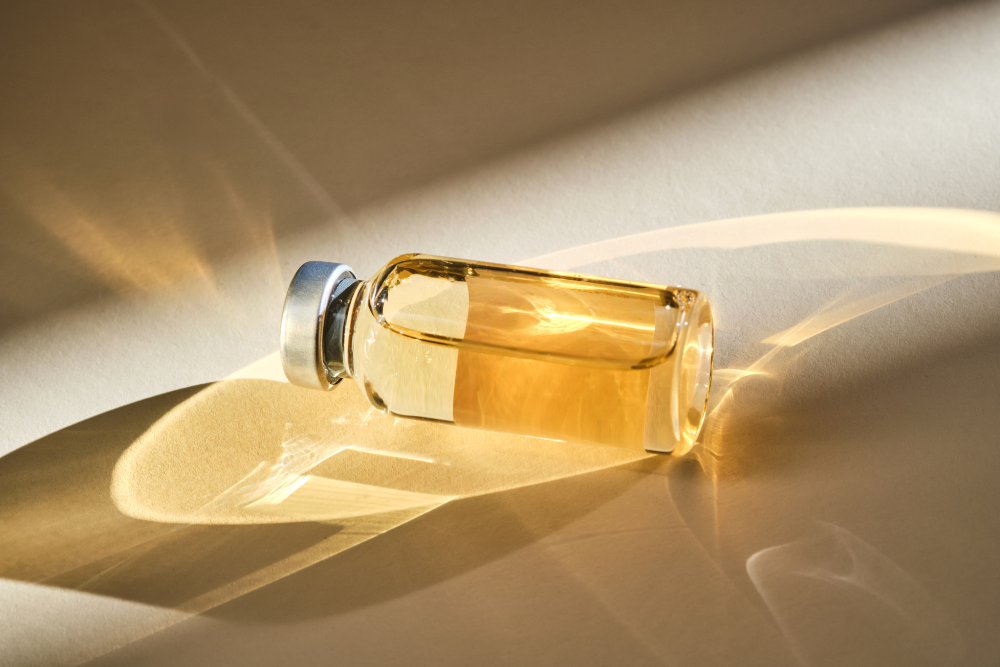 Vial of skincare peptides under natural light.